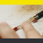 The hand of a Aluminum wiring electrician