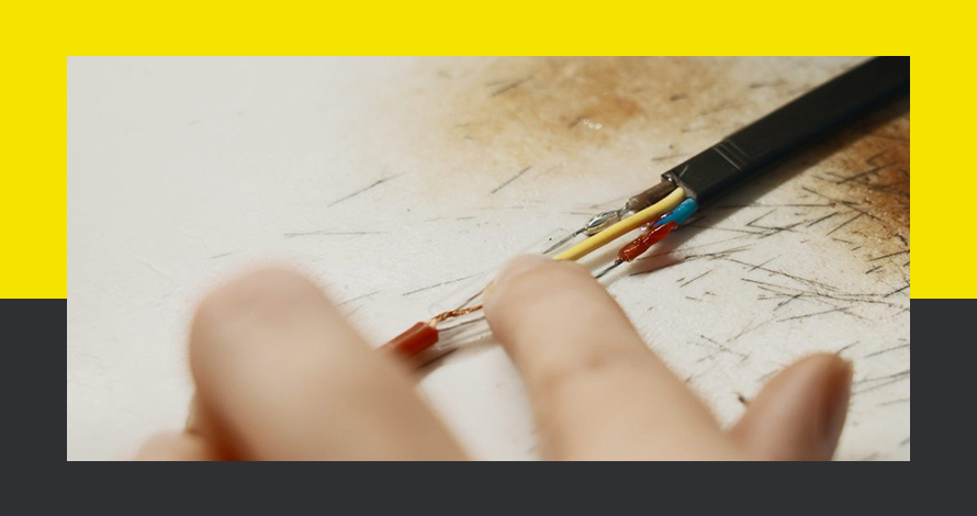 The hand of a Aluminum wiring electrician