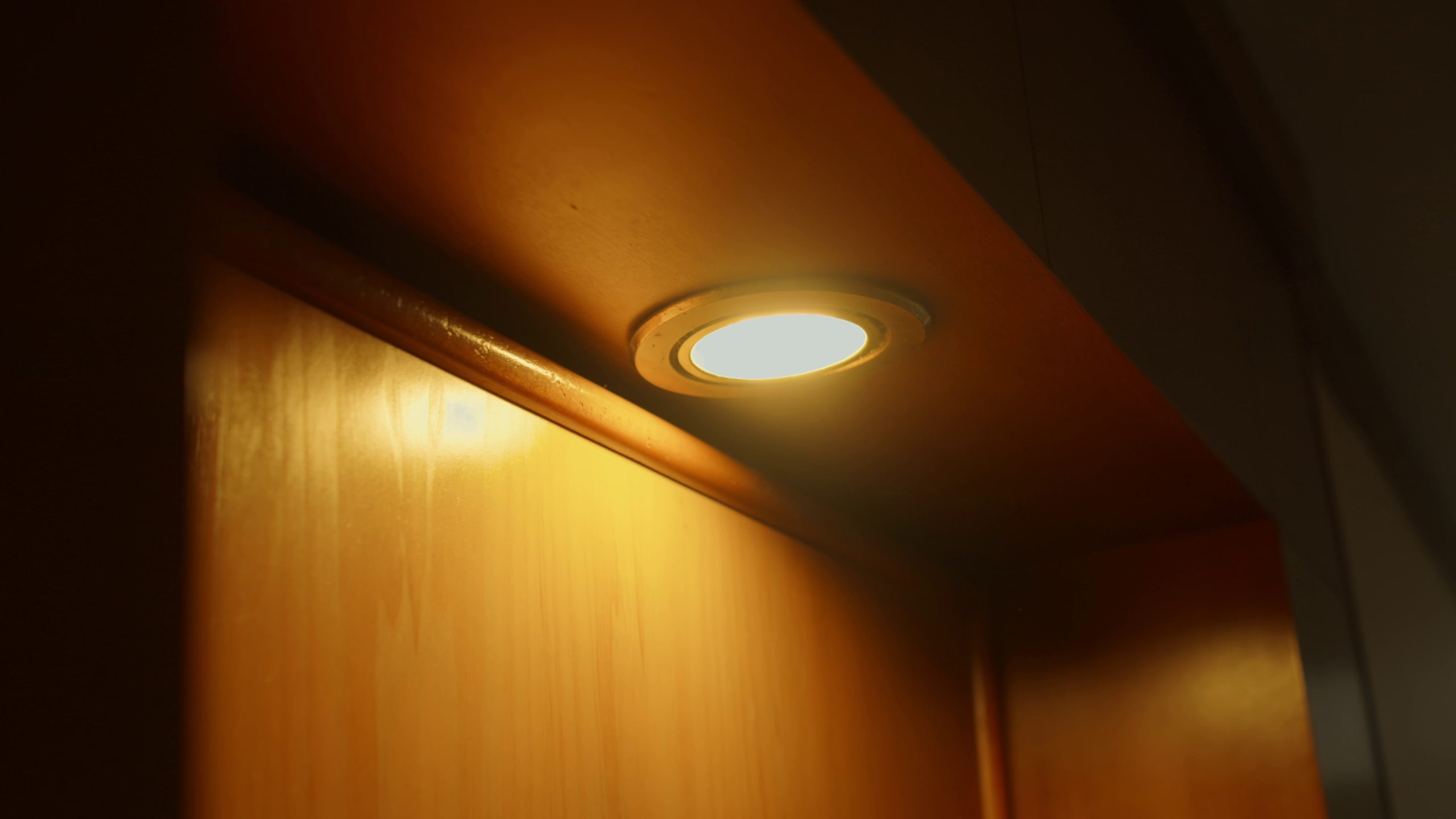 Warm light from recessed lighting in a ceiling