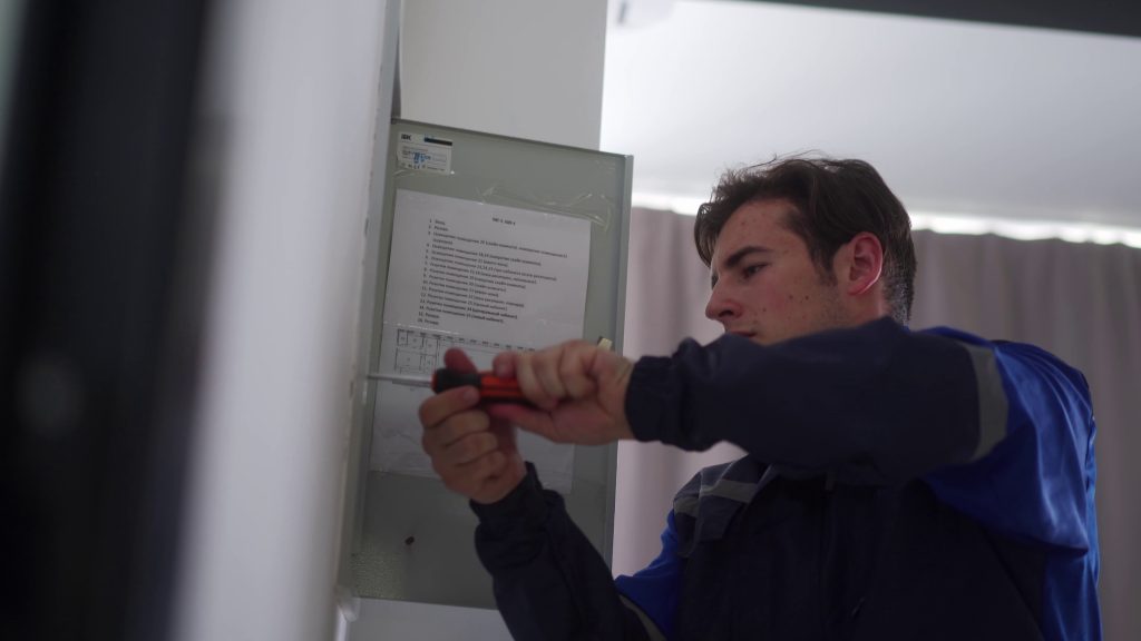 electrician installing a SPAN smart panel in a residential home